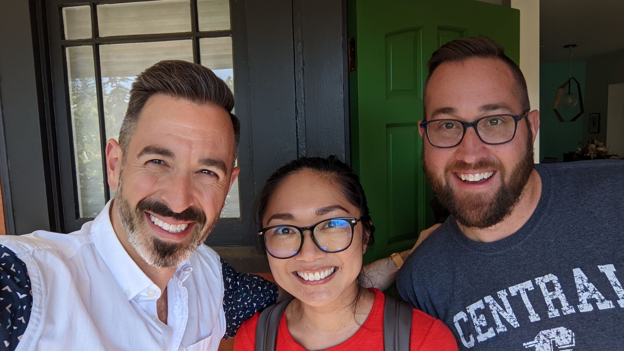 A photo shows Amanda and SparkToro's co-founders, Rand Fishkin and Casey Henry, smiling for a selfie. End description.